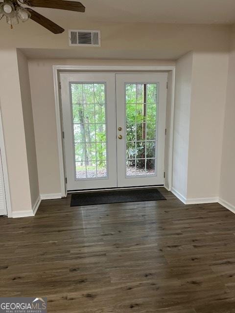 doorway to outside featuring dark hardwood / wood-style flooring, ceiling fan, and french doors