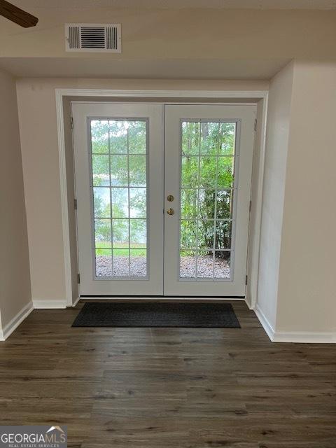 doorway to outside with french doors, dark hardwood / wood-style flooring, and ceiling fan