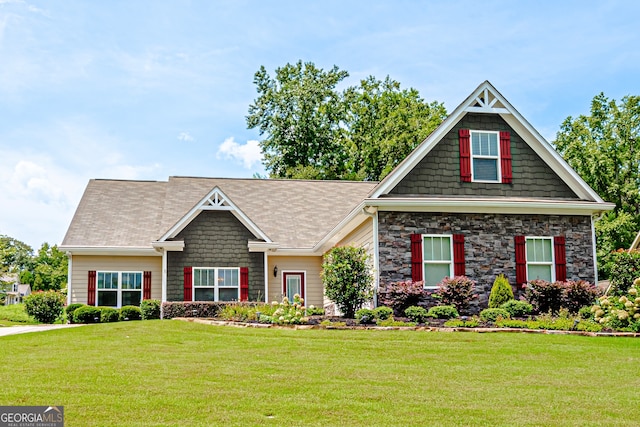 craftsman inspired home with a front yard