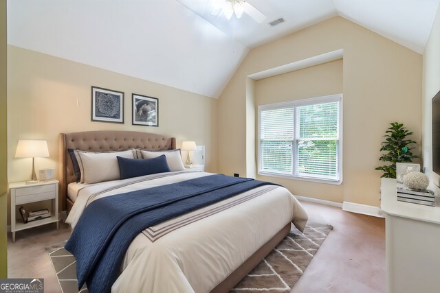 bedroom featuring carpet floors, lofted ceiling, and ceiling fan