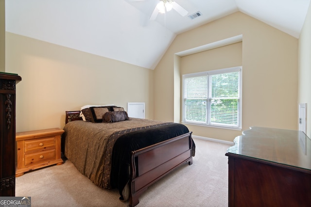 bedroom featuring vaulted ceiling, ceiling fan, visible vents, and light colored carpet