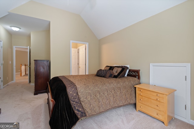 bedroom featuring light carpet and vaulted ceiling