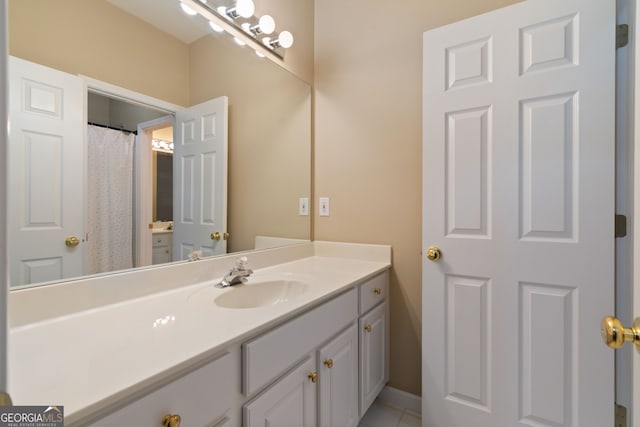 bathroom with vanity and tile patterned floors