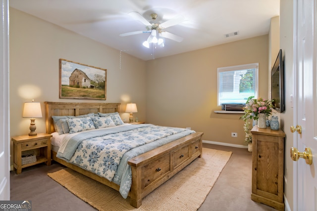 bedroom with light carpet, baseboards, visible vents, and a ceiling fan