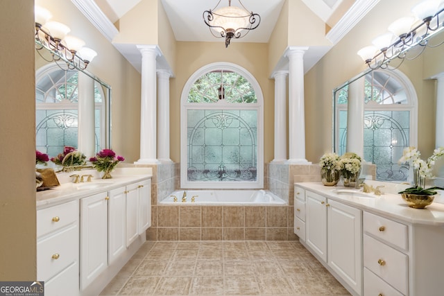 full bathroom with a chandelier, a sink, and ornate columns