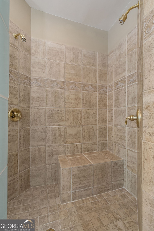 full bath featuring tiled shower