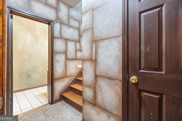 stairs featuring tile patterned flooring