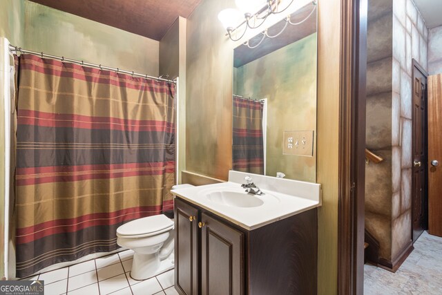 bathroom with tile patterned flooring, toilet, and vanity