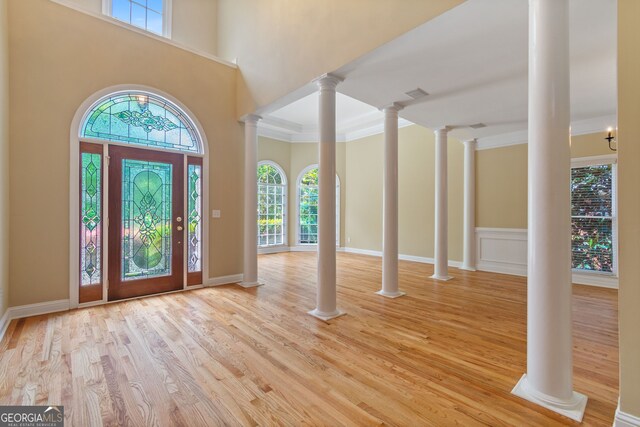 entryway with light hardwood / wood-style flooring and a wealth of natural light