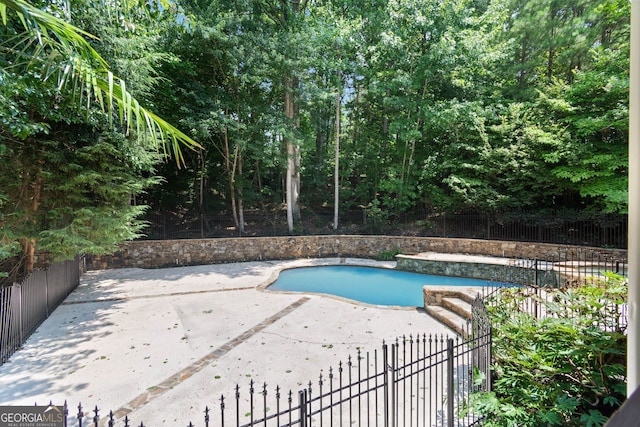 view of pool featuring a fenced in pool, a patio area, and fence