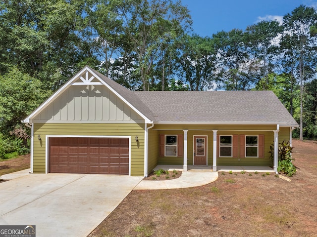 view of front of house with a garage and covered porch