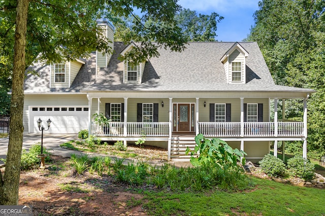 view of front of home featuring a porch and a garage