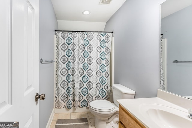 bathroom featuring vanity, tile patterned flooring, and toilet