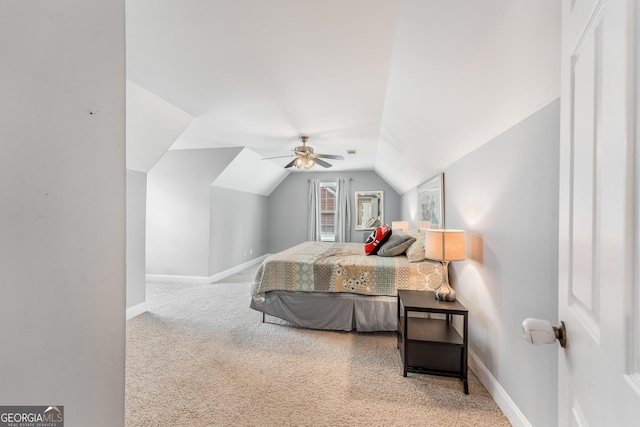 bedroom with lofted ceiling, carpet flooring, and ceiling fan