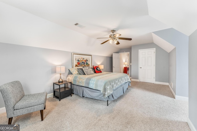 bedroom with light carpet, vaulted ceiling, and ceiling fan