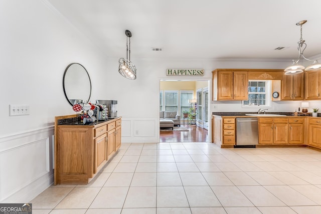 kitchen with sink, light hardwood / wood-style floors, decorative light fixtures, dishwasher, and ornamental molding