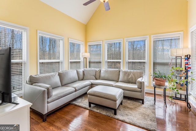 sunroom with ceiling fan and lofted ceiling