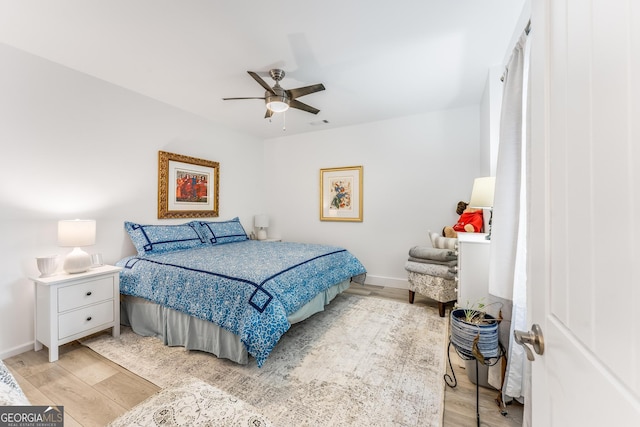 bedroom featuring light hardwood / wood-style flooring and ceiling fan