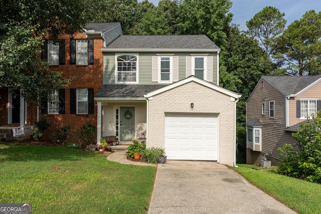 view of front of house featuring a garage and a front yard