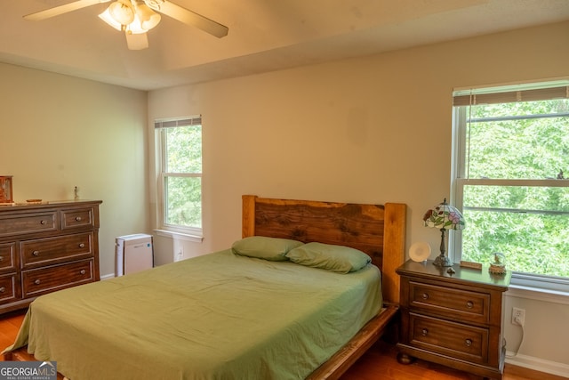 bedroom featuring hardwood / wood-style flooring and ceiling fan