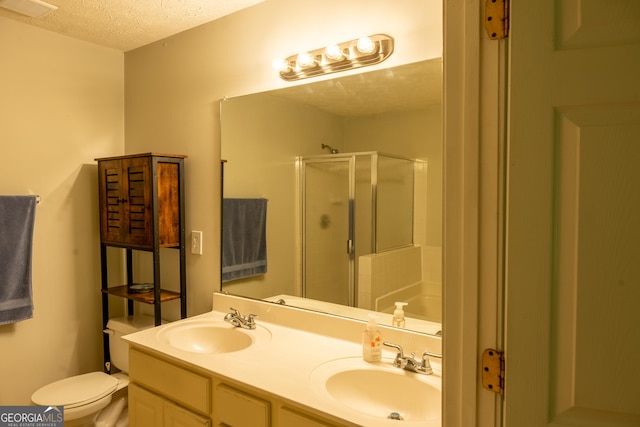 full bathroom with toilet, vanity, shower with separate bathtub, and a textured ceiling