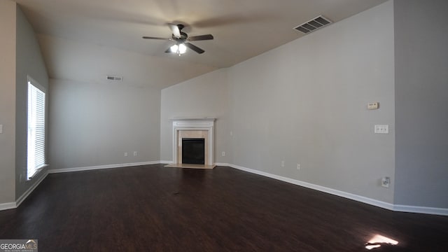 unfurnished living room with ceiling fan, lofted ceiling, and dark wood-type flooring