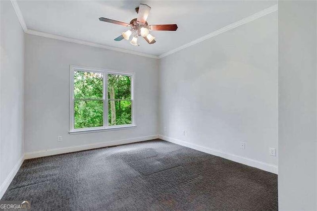 spare room featuring a ceiling fan, baseboards, crown molding, and carpet flooring