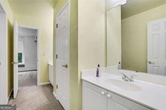 bathroom featuring vanity and baseboards