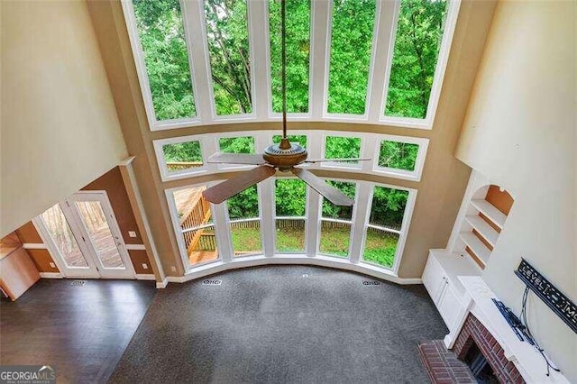 interior space featuring a ceiling fan and baseboards