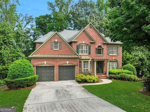 view of front of property with brick siding, driveway, and a front lawn