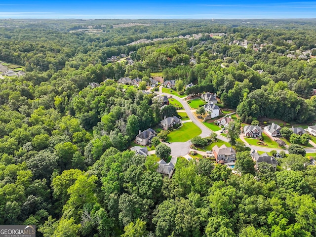 aerial view with a residential view and a view of trees