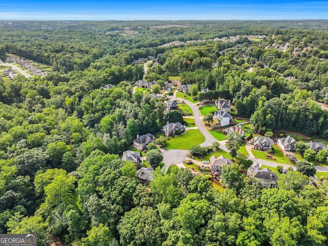 aerial view with a residential view and a view of trees