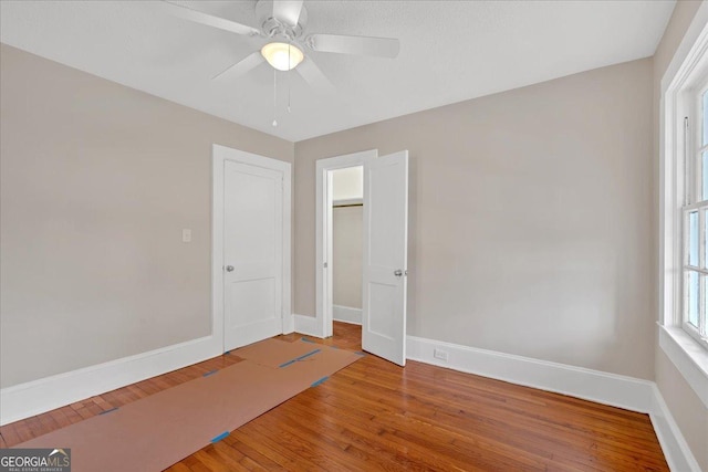 interior space with hardwood / wood-style flooring and ceiling fan