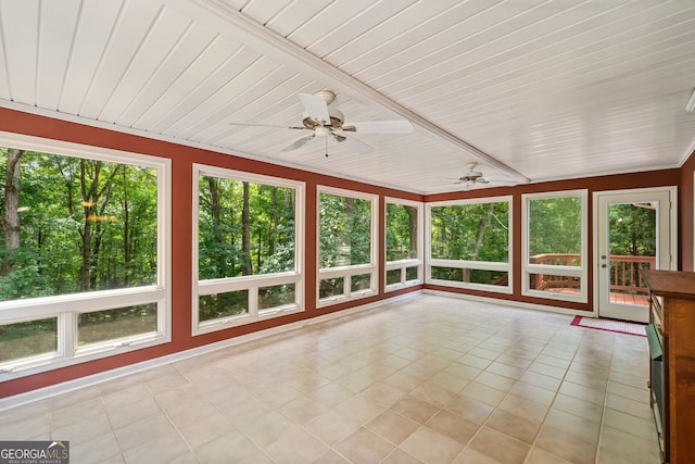 unfurnished sunroom featuring ceiling fan