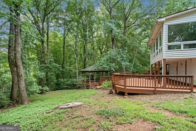 view of yard featuring a wooden deck