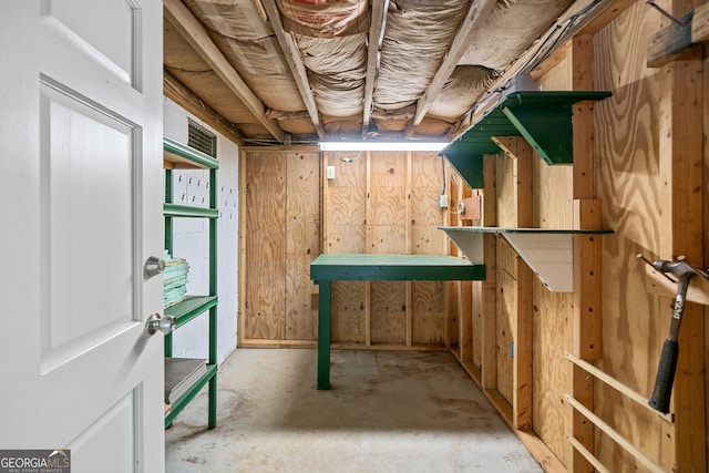 interior space featuring wood walls