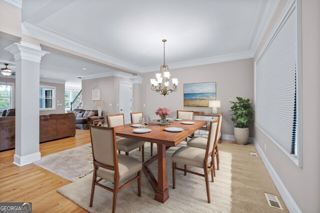 carpeted entryway featuring a high ceiling, crown molding, a chandelier, and french doors