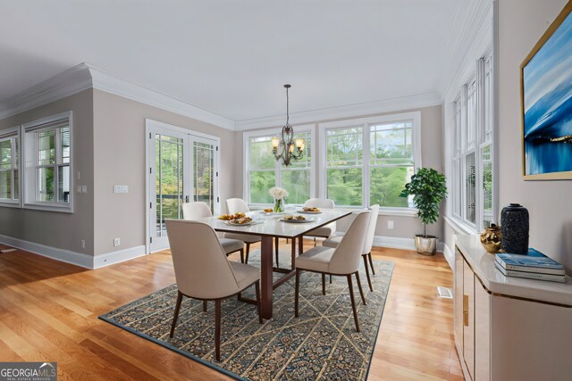 kitchen featuring sink, light hardwood / wood-style flooring, and an island with sink