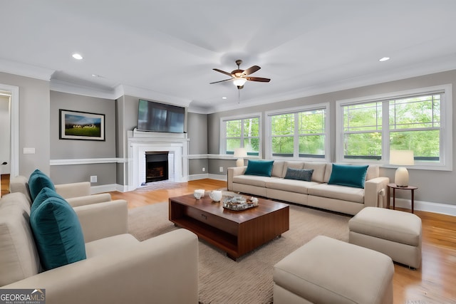 kitchen featuring light hardwood / wood-style flooring, tasteful backsplash, light stone counters, appliances with stainless steel finishes, and sink