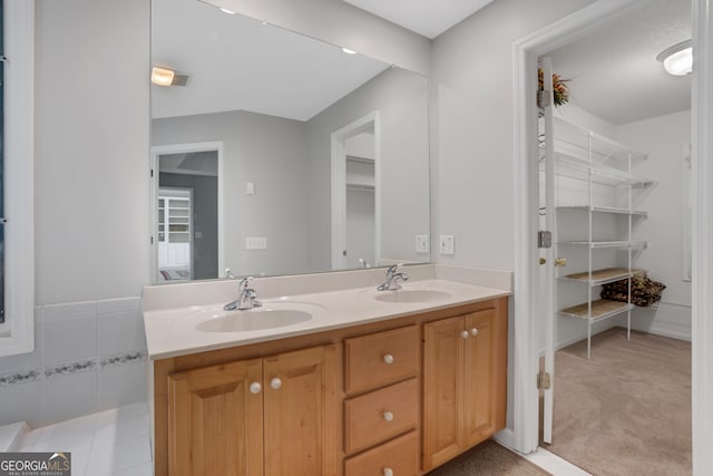 bathroom featuring dual vanity and tile patterned floors