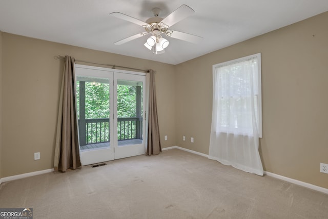 carpeted empty room with ceiling fan