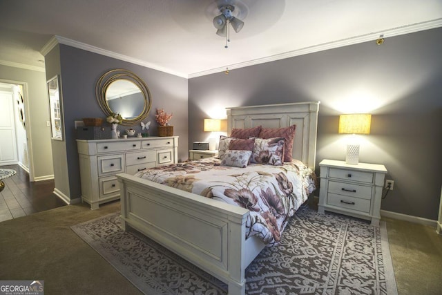 carpeted bedroom with ceiling fan and ornamental molding