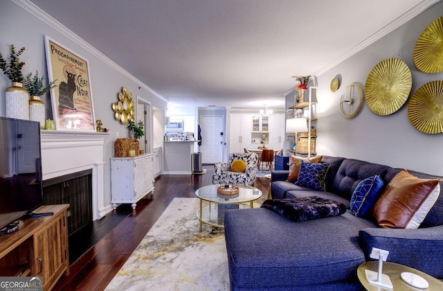 living room with crown molding and dark hardwood / wood-style flooring