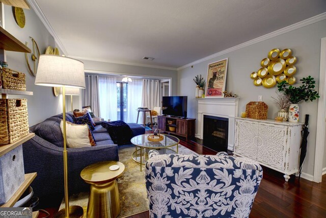 living room with dark hardwood / wood-style floors and ornamental molding