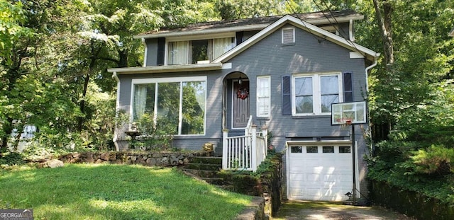 view of front of home featuring a garage and a front yard