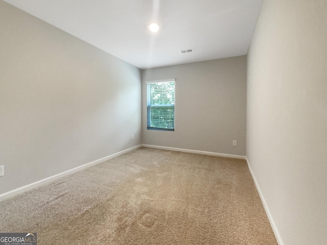 spare room featuring carpet floors