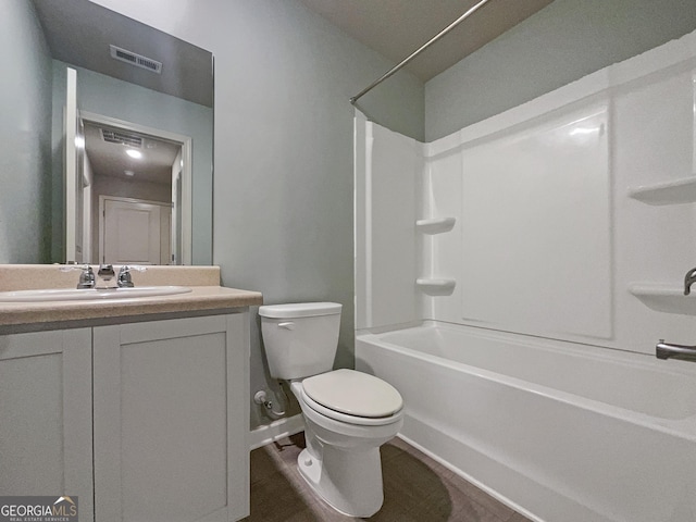 full bathroom featuring vanity, tub / shower combination, and toilet