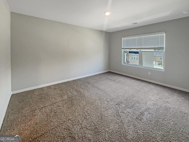 unfurnished room featuring carpet floors