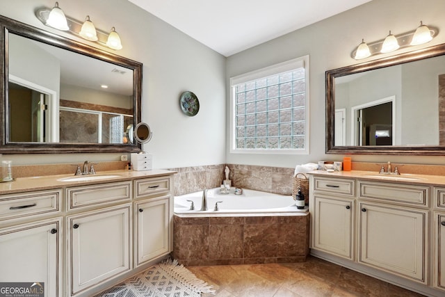 bathroom featuring independent shower and bath and vanity