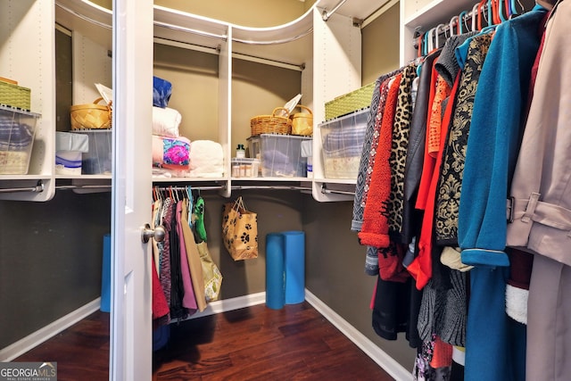 spacious closet featuring hardwood / wood-style floors